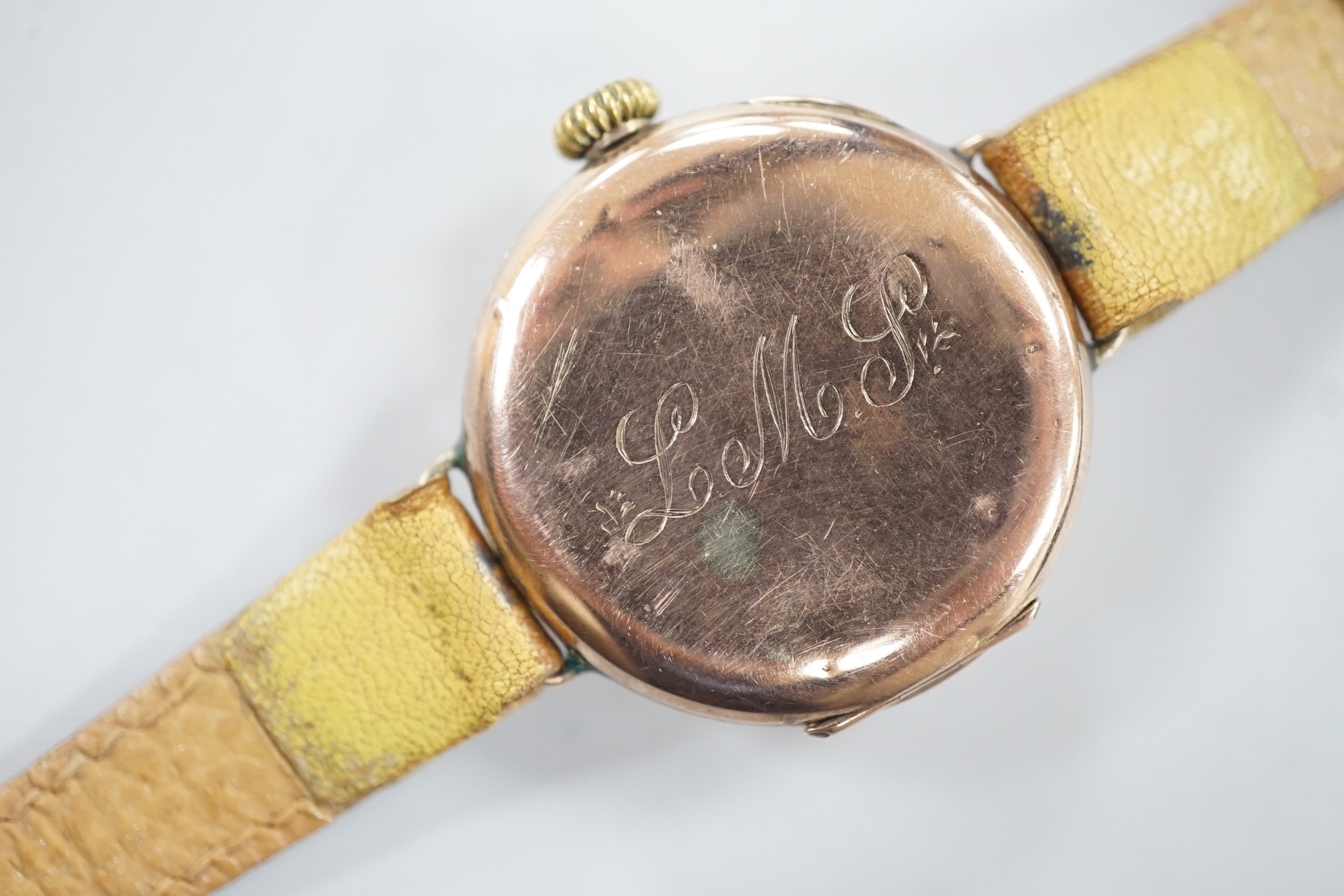 A gentleman's George V 9ct gold Rolex manual wind wrist watch, with Arabic dial, case hallmarked for London, 1915, the case back with engraved initials, on a later associated leather strap, case diameter 28mm.